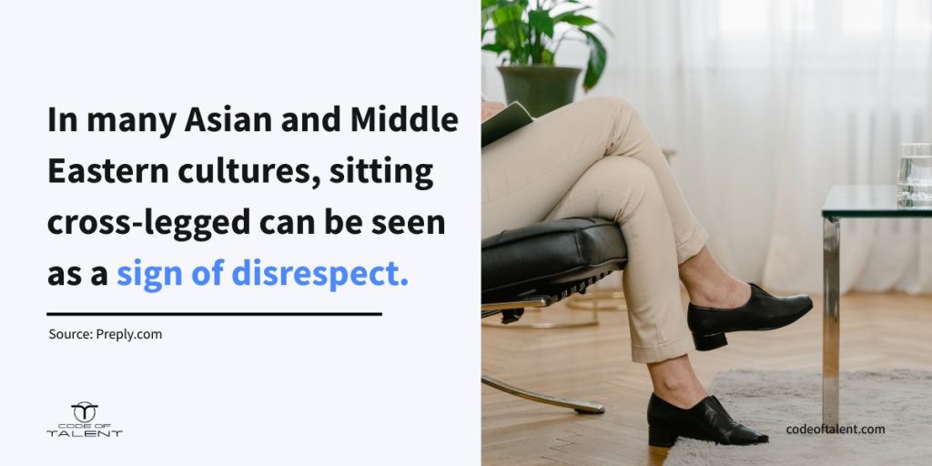 Infographic showing the stat "Sitting cross-legged is considered disrespectful in many Asian and Middle Eastern cultures", which explains why it's important to have good nonverbal communication in the workplace
